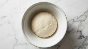 Dough ball in mixing bowl
